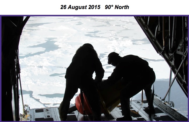 Loadmasters dropping an Airborne Expendable Ice Buoy (AXIB) buoy from the open back ramp at the North Pole